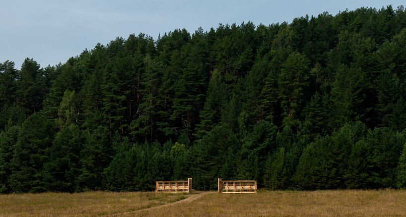 as contemporary propylaea, twin timber gateways frame open-air architectural park in russia - 1