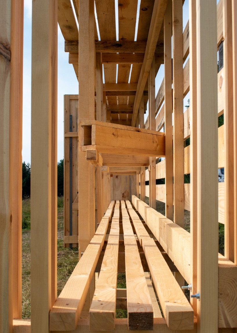 as contemporary propylaea, twin timber gateways frame open-air architectural park in russia - 3