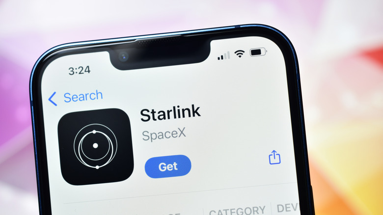 Close-up of a smart phone displaying the download screen for the Starlink app