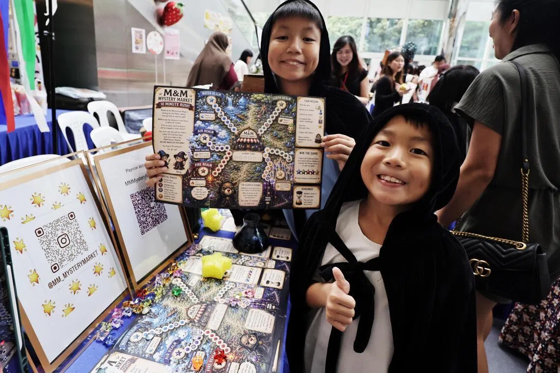 Brothers Malcolm Ng, 11 (left) and Magnus Ng, 8, created a board game called Element Rush.