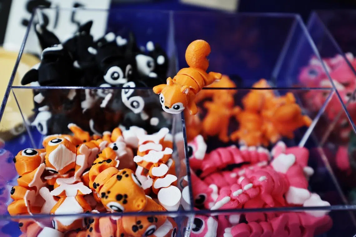 A selection of Rui Qi’s 3D-printed figurines at his booth.