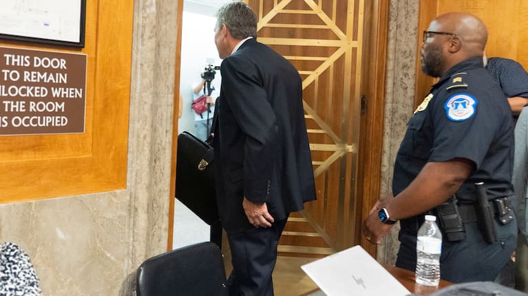 David Schertler, Dr Anthony Fauci’s defence lawyer, is escorted out, as Fauci appears before the Senate Homeland Security and Governmental Affairs Committee at the Capitol, Wednesday, July 29, 2026, in Washington.