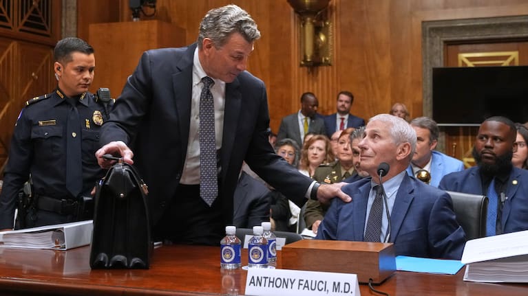 David Schertler, Dr Anthony Fauci's defence lawyer, is escorted out, as Fauci appears before the Senate Homeland Security and Governmental Affairs Committee at the Capitol, Wednesday, July 29, 2026, in Washington.