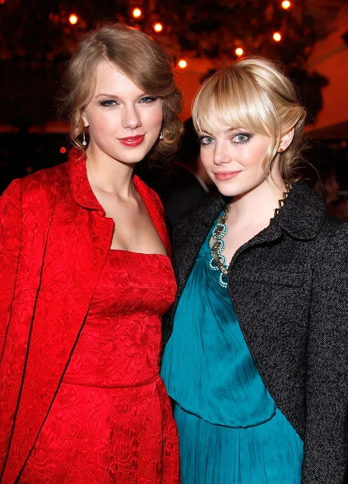 Taylor Swift and Emma Stone at a cocktail party in February 2011.Credit: Getty