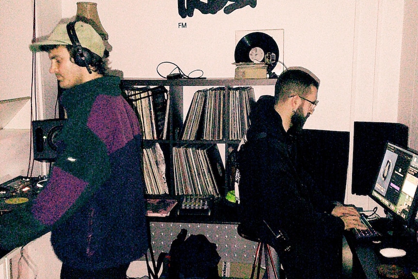 People in a studio with the logo Trust, written on the wall.