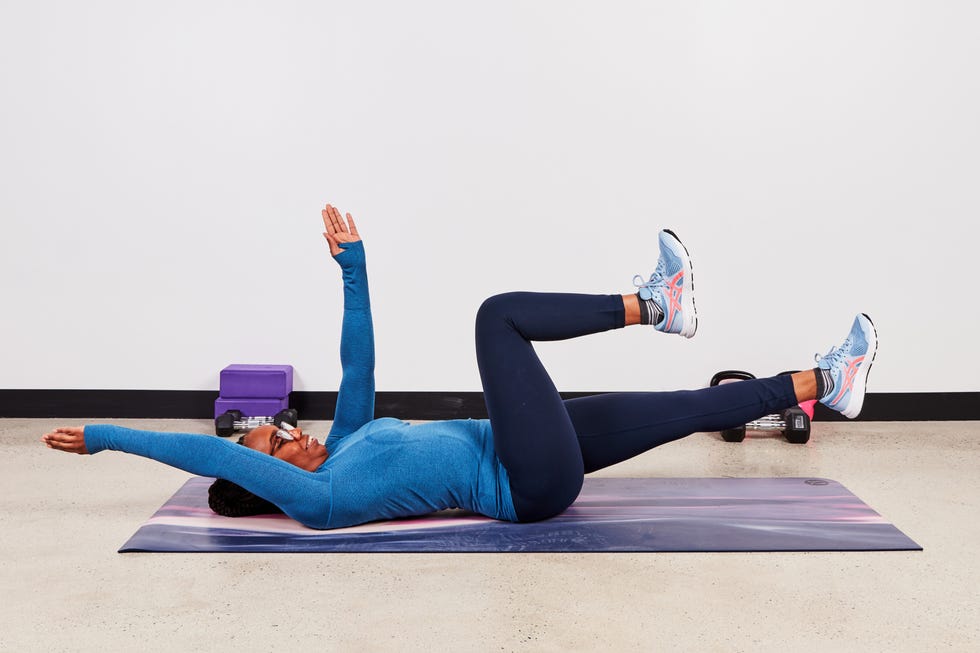 monique doing a dead bug exercise for fitness