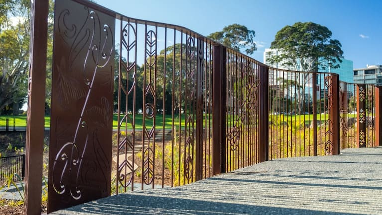 Decorative artwork on the bridge at Manu-kau Noa Iho Hayman Park reflects cultural design incorporated into the park's regeneration.