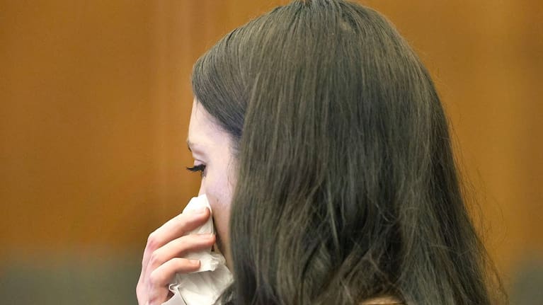 Defendant Lindsay Clancy fights back tears as the details of her children's death are read in court. (Source: Greg Derr/The Patriot Ledger via AP, Pool)