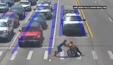 Driver dressed as Spider-Man leaps to the aid of man in a wheelchair