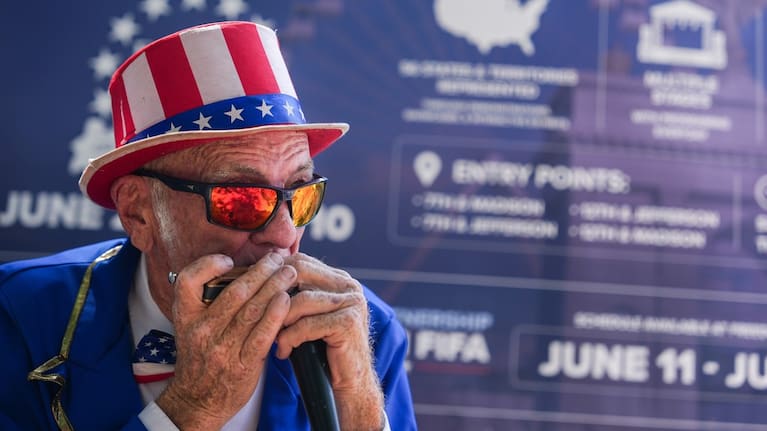 Duane Schwingel plays a harmonica on the National Mall in Washington.
