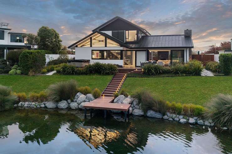 A four-bedroom home on East Stream Lane, in Clearwater, Northwood, fetched $2.455m at auction. Photo / Supplied