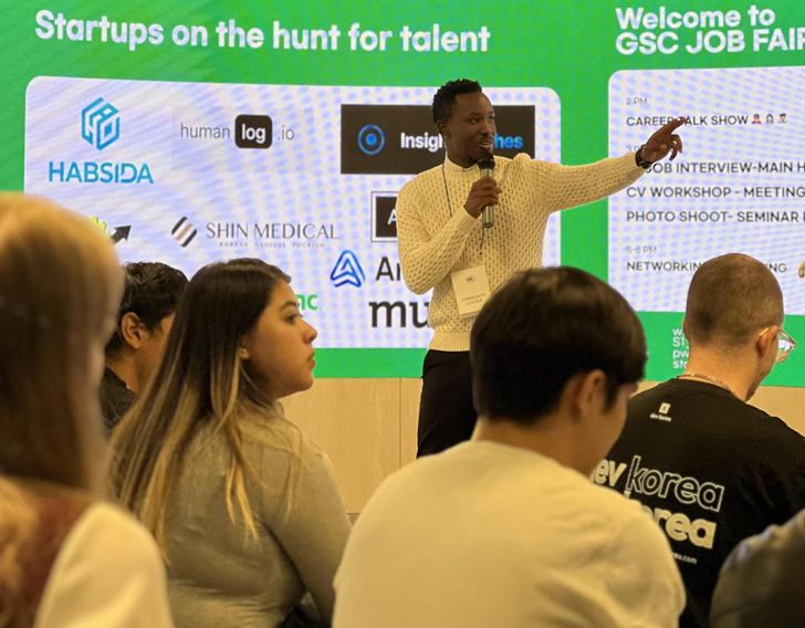Acafo founder Casimir Agossou speaks during a job fair in October 2025. Courtesy of Acafo