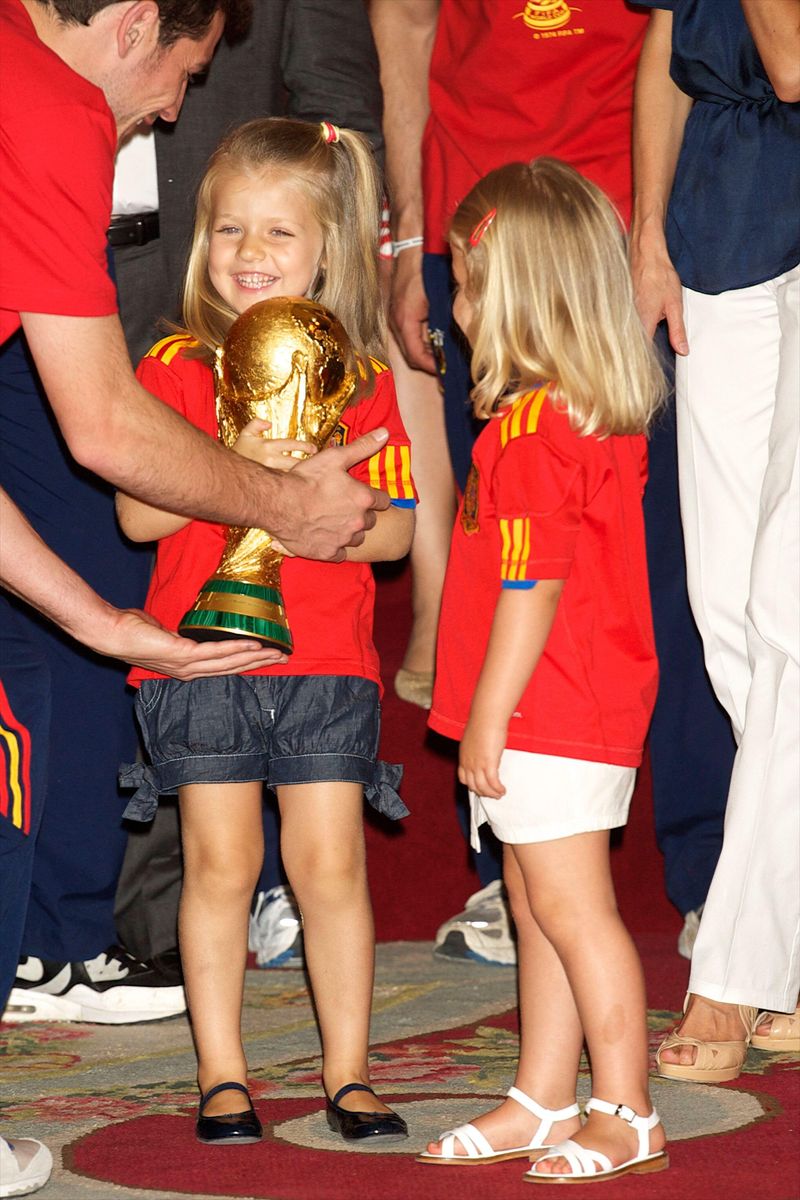 Princess Leonor beams as she proudly holds the World Cup trophy during the Royal Palace reception in Madrid.
