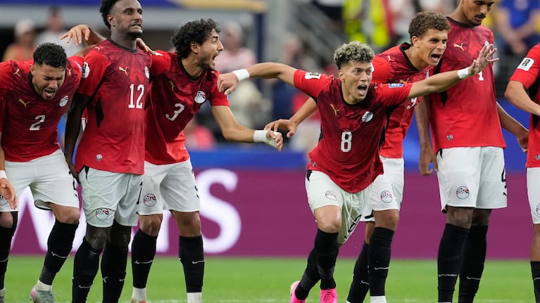 Egypt players react during a penalty shootout against Australia