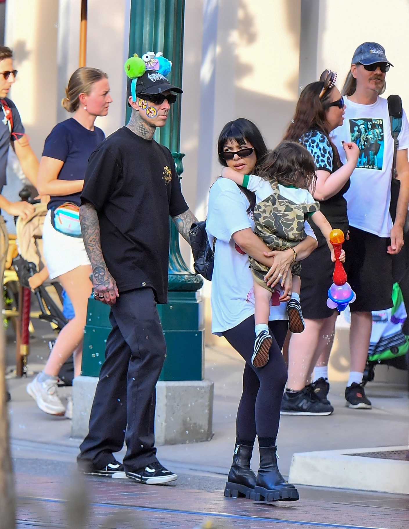 Kourtney Kardashian and her husband Travis Barker spend 4th of July at Disneyland with their kids.