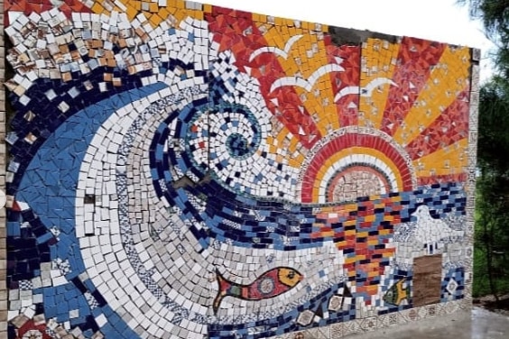 A mural with bright tiles and similar theme to Sunset Wave by a South Australian artist.