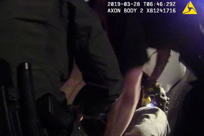 In this image from a March 28, 2019, body-worn camera video provided by the Austin Police Department in Texas, Williamson County deputies hold down Javier Ambler as one of them uses a Taser on Ambler's back during his arrest.