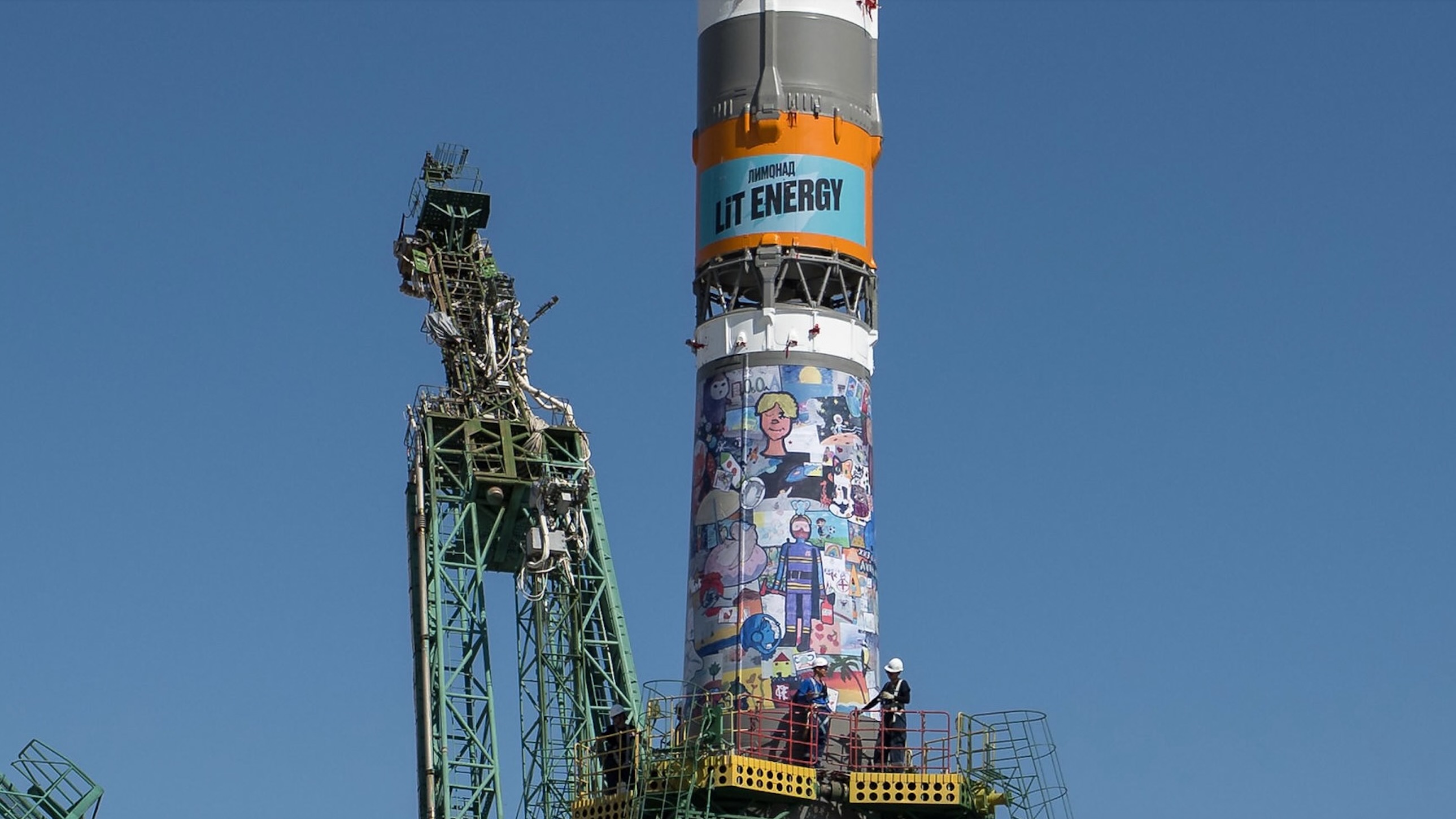 Zoomed-in view of the Soyuz rocket that launched NASA astronaut Anil Menon and two cosmonauts to the ISS on July 14, 2026. This shot shows the ad for Lit Energy.