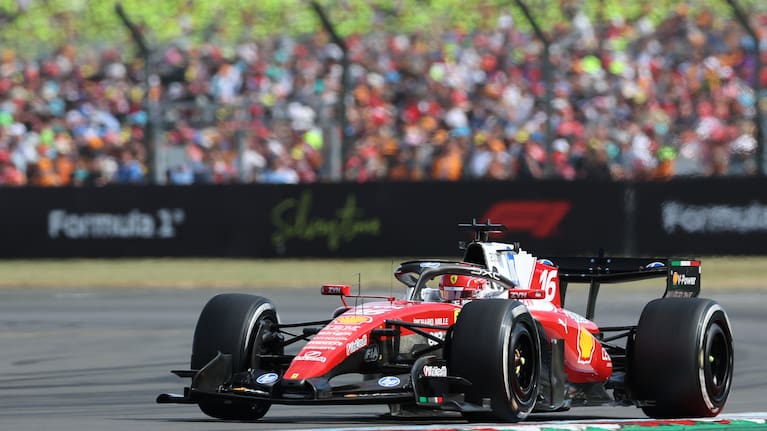 Ferrari driver Charles Leclerc of Monaco celebrates with his team after winning the British F1 Grand Prix, in Silverstone, England.