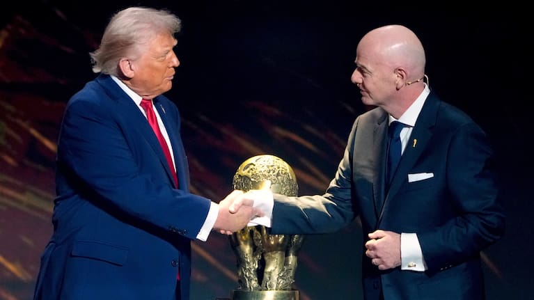 FIFA President Gianni Infantino, right, awards President Donald Trump with the FIFA Peace Prize during the draw for the 2026 soccer World Cup at the Kennedy Center in Washington, Dec. 5, 2025.