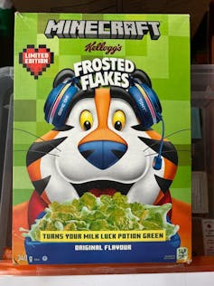A box of Minecraft-themed Frosted Flakes with green flakes that turn milk 'luck potion green'