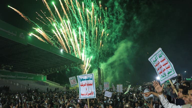 Fireworks burst as Houthi supporters rally against the Saudi-led coalition in Sanaa, Yemen.
