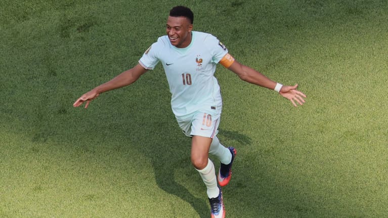 France's Kylian Mbappe (10) celebrates scoring the opening goal during the World Cup quarterfinal soccer match between France and Morocco.