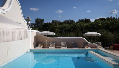 This picture taken on October 17, 2025 shows a view of the pool at "Vermelho" hotel, owned by French designer Christian Louboutin, one of the first international figures to discover the region, in Melides, southwestern Portugal. Above the pine forests and dunes stretching along the nearly deserted beaches of southwestern Portugal, cranes rise from luxury hotel projects, a sign of the region's transformation into a new playground for the rich. The coastal region of Comporta has attracted high-profile visitors, earning the nickname "the new Portuguese Riviera" and drawing comparisons to New York's elite Hamptons. (Photo by Patricia DE MELO MOREIRA / AFP) (Photo by PATRICIA DE MELO MOREIRA/AFP via Getty Images)