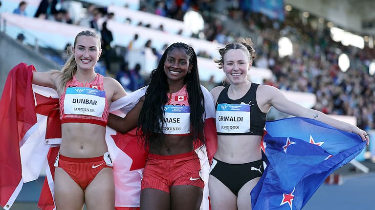 Gold medalist Sheriauna Haase of Team Canada, Silver medalist Chloe Dunbar of Team Canada and Bronze medalist Anna Grimaldi of Team New Zealand pose for a photo after the Women's 100 Metres T47 Final.