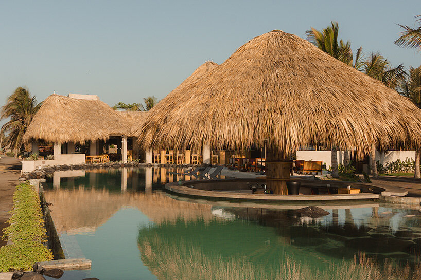 gris shapes naturally cooled beach club around series of open-air pavilions in guatemala - 3