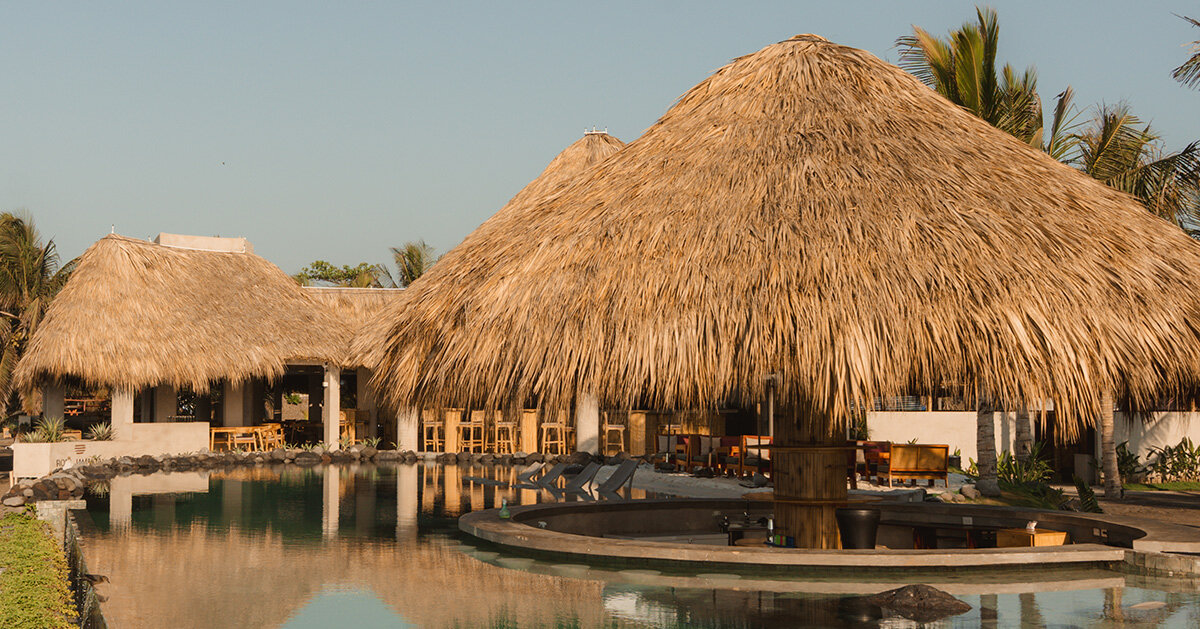 gris disperses beach club into a series of pavilions in guatemala