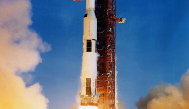 A Saturn V rocket accelerates off the pad. Sustained acceleration is exactly what conjures the faint quantum glow of Unruh radiation. Credit: NASA (public domain).
