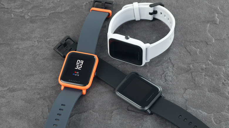 A variety of smartwatches laid out