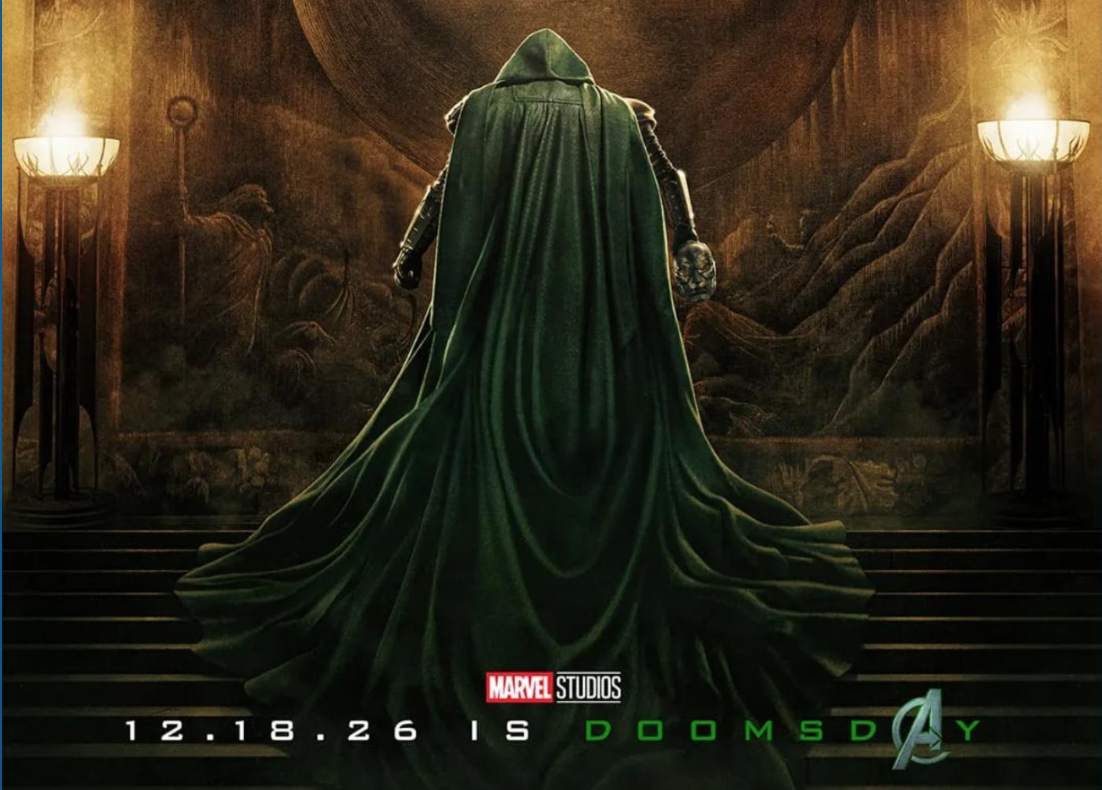 a caped villain in green showcases a movie promo poster