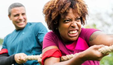 My husband, 40, dreams of retiring by 55. But I just want to spend our money and have fun now. What do we do?