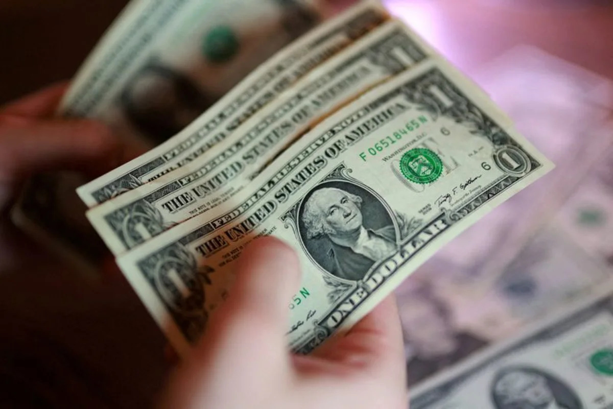 Dollar gains before US jobs report, Fed's Warsh sees improving inflation