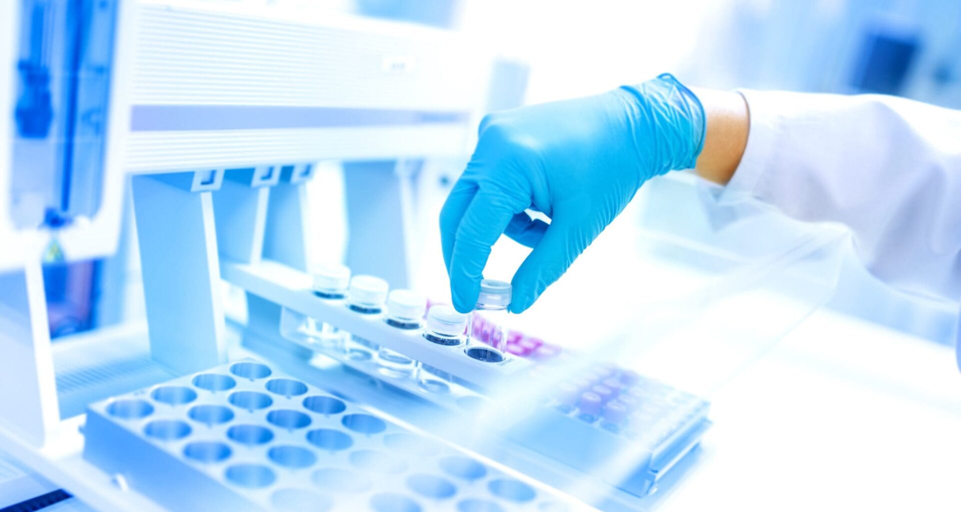 Scientist using protective robber gloves for handling substances and experiments
