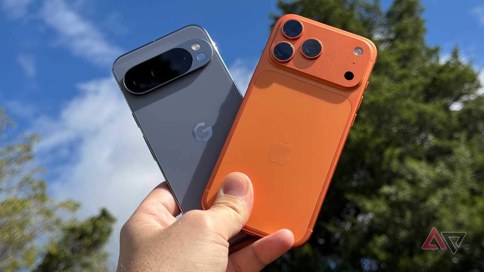 Google Pixel 10 Pro XL held up next to an Apple iPhone 17 Pro Max