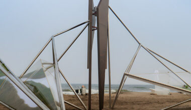 interconnected metal rods form a winged installation on china's coastline