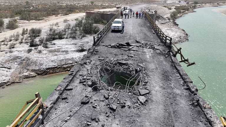 In this handout photo by Morteza Akhoundi via Getty Images, a hole is visible in a damaged bridge, following US airstrikes carried out a day earlier, on July 17, 2026 in the southern Hormozgan Province, Iran.