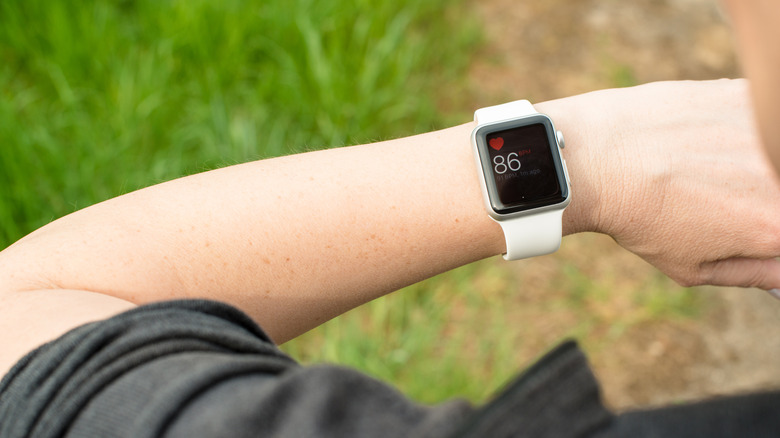 A person checking their heart rate on an Apple Watch
