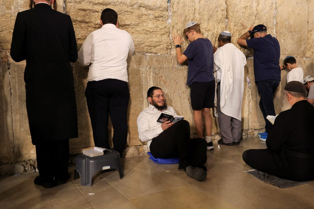 Jewish worshippers mark Tisha B'Av, a day of fasting and lament, in Jerusalem's Old City