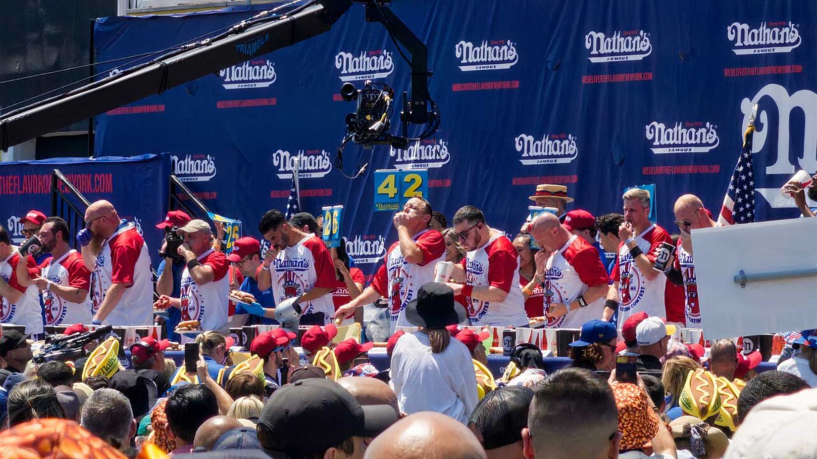 Joey Chesnut eats hot dogs in the contest.