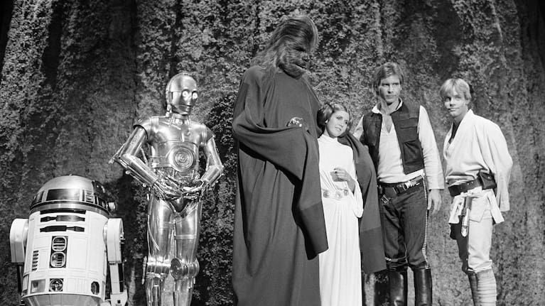 Kenny Baker, from left, Anthony Daniels, Peter Mayhew, Carrie Fisher, Harrison Ford and Mark Hamill are seen during the filming of the CBS-TV special, The Star Wars Holiday, in Los Angeles, November 13, 1978.