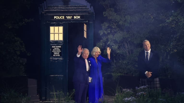 King Charles and Queen Camilla wave as Sir Chris Hoy looks on at The 2026 Commonwealth Games opening ceremony