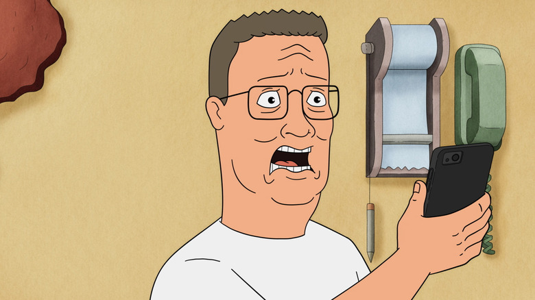 Hank Hill screaming while looking at his phone