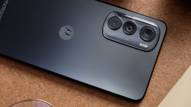Moto Edge 30 on cork table face down showing camera bump