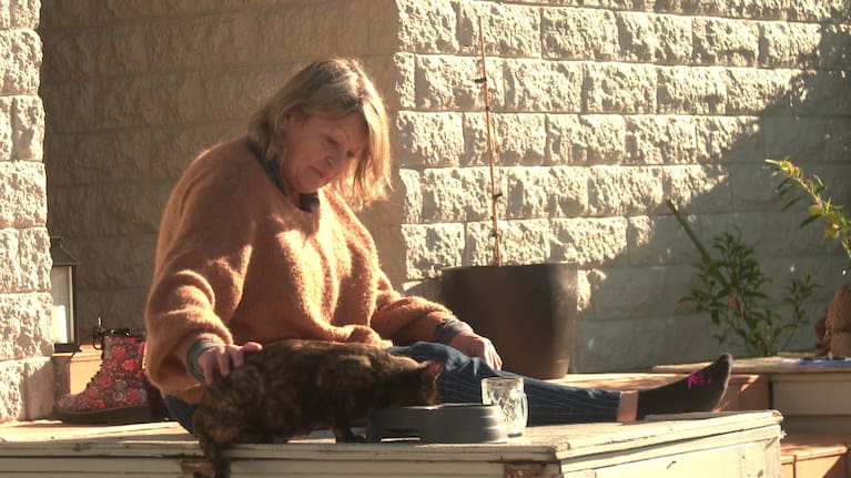 Lee Henderson and her new cat Goldie.
