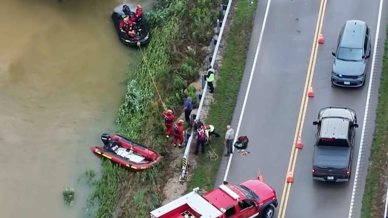 Emergency workers rescuing and searching during Lesterville floods.