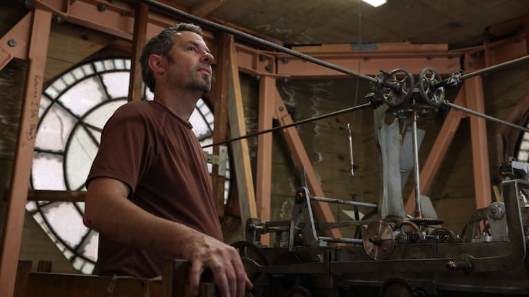 Local clockmaker Blair Shallard inside the Seddon clock. (Source: Rotorua Lakes Council)